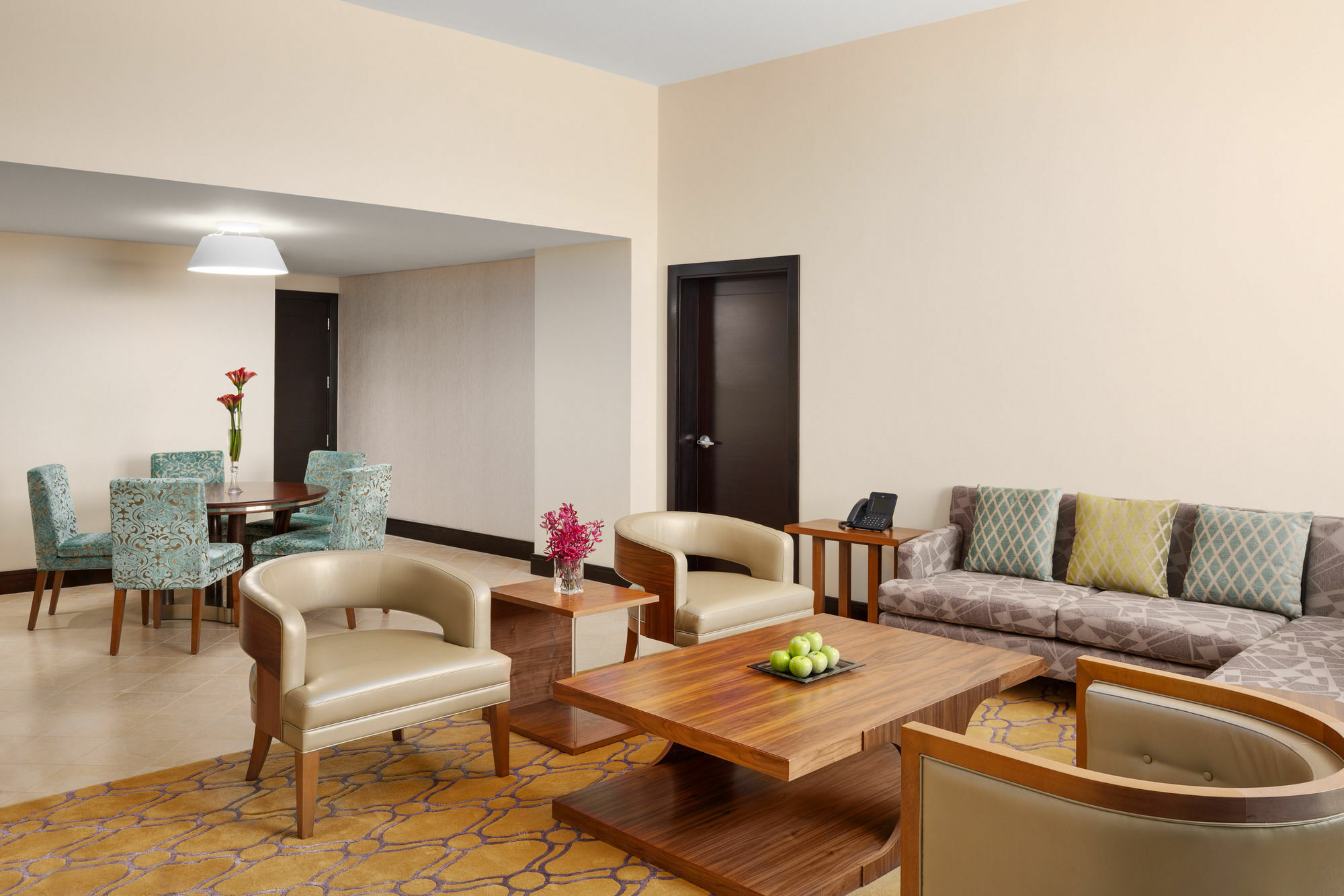 Millennium Hail Hotel Екстериор снимка A living room in a suite at the hotel